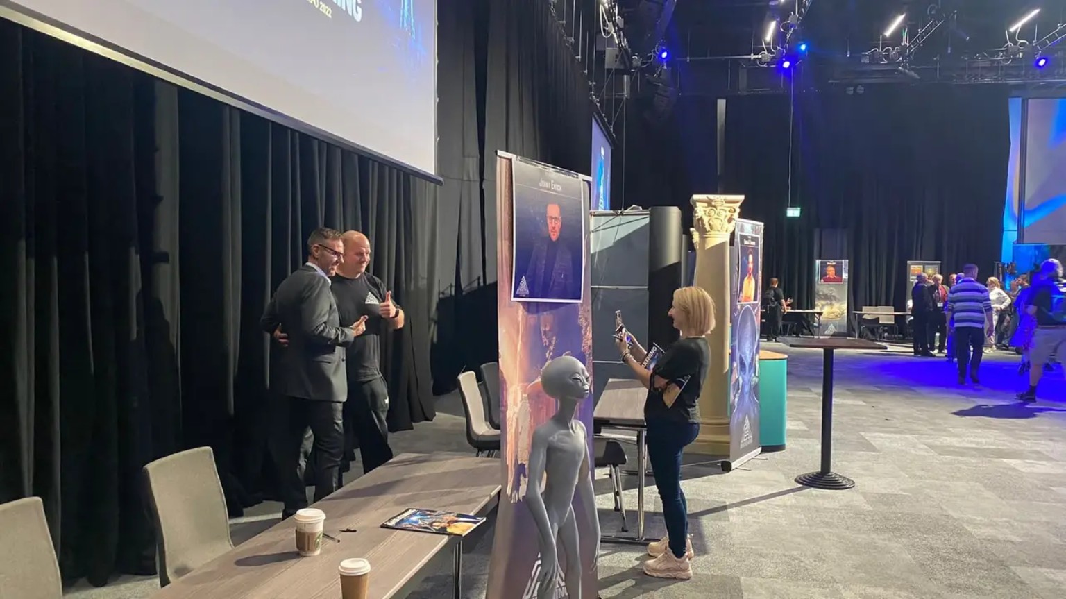 Jonny Enoch posing for a photograph with a conference attendee