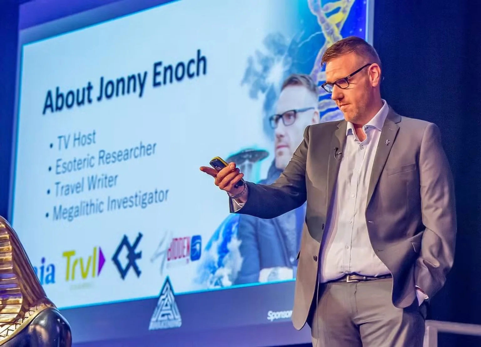 Jonny Enoch speaking in front of his presentation