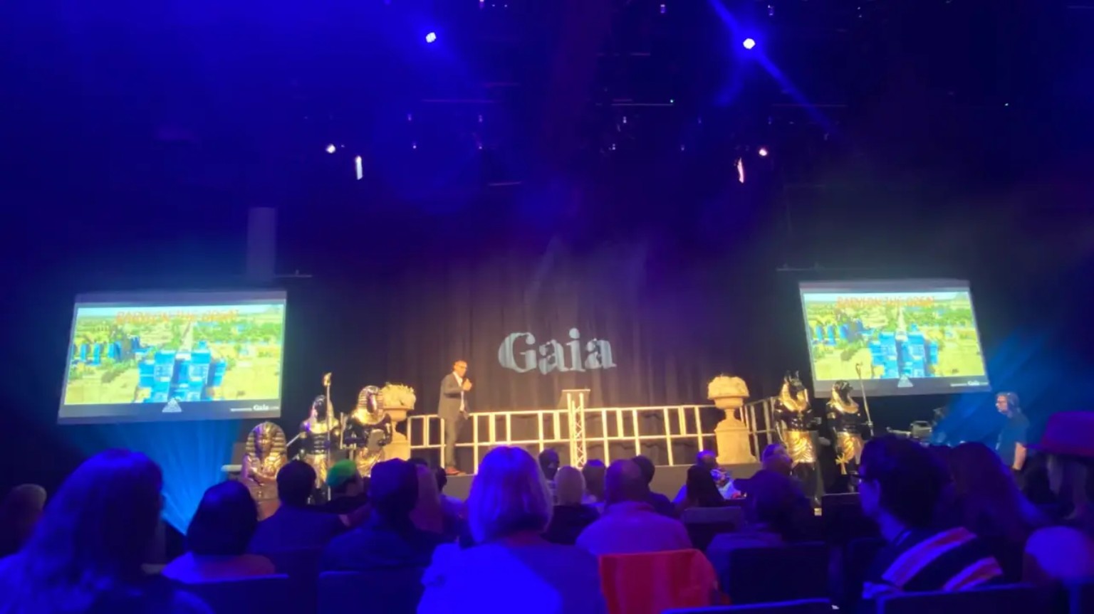 Jonny presenting onstage at a Gaia event