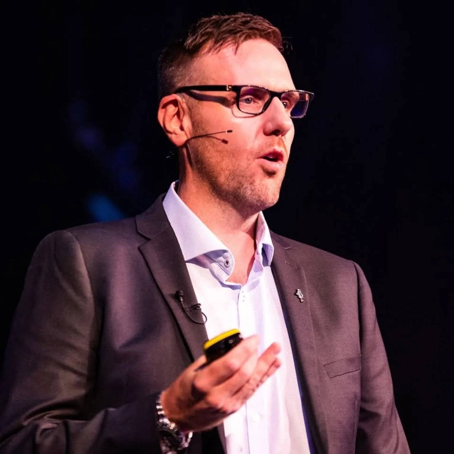 Jonny Enoch speaking on stage