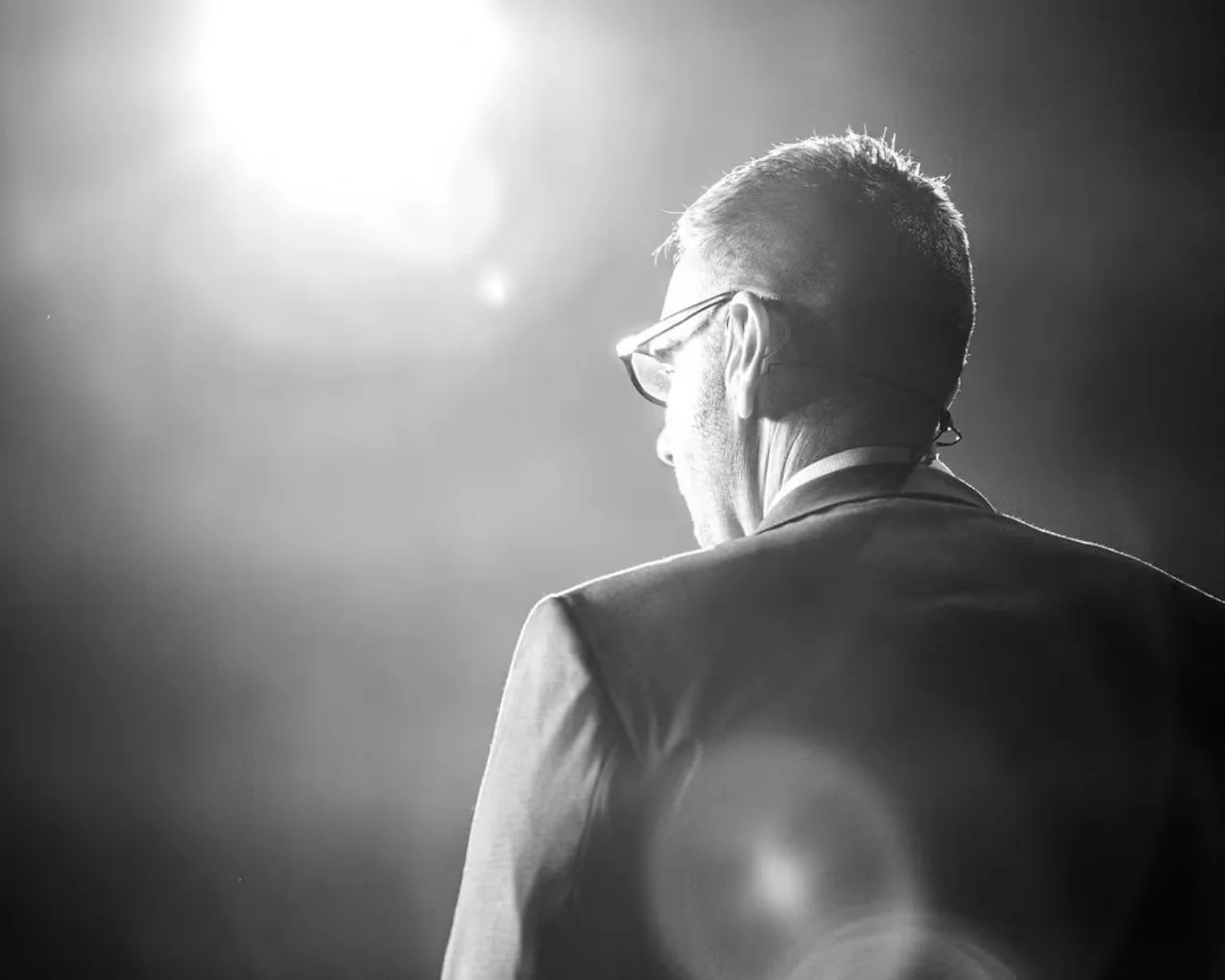 Jonny Enoch seen from behind while presenting